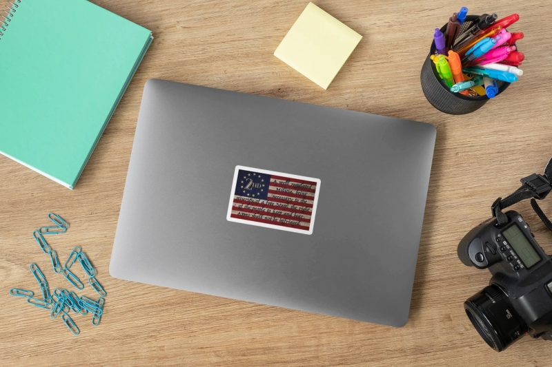 mockup of a sticker on a laptop placed next to some stationery items 33603 9 2000x 97830d1a 140a 45a5 bc65 723f2fb445e0